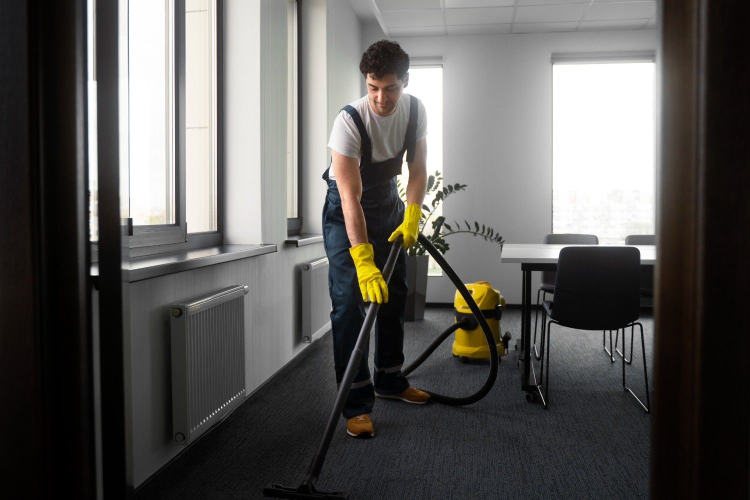 full-shot-man-cleaning-indoors (1)