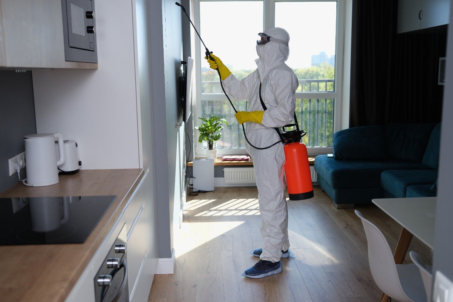 person-white-protective-suit-mask-gloves-with-balloon-disinfection-kitchen (1)